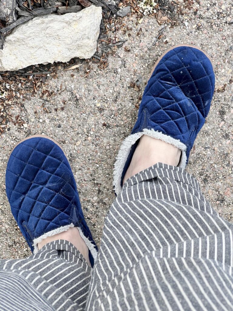 Scruffy blue slippers.