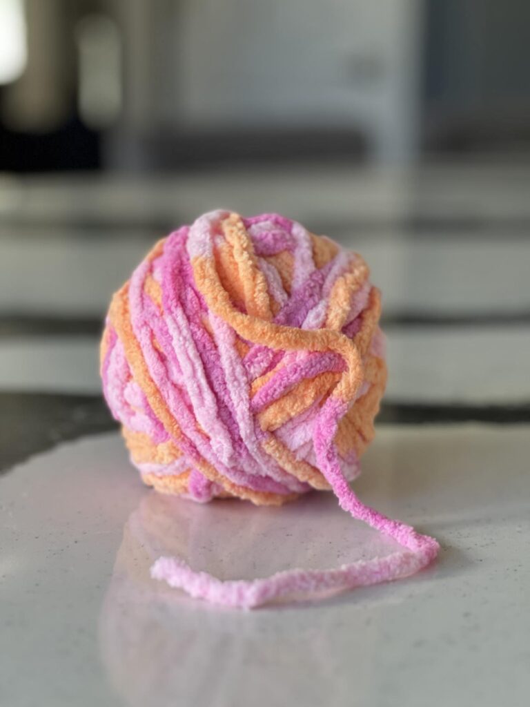 A ball of yarn used for diy wall decor.