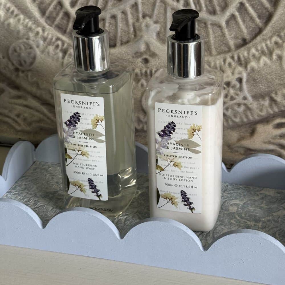 A scallop edge wood tray with a wallpaper scrap lining.