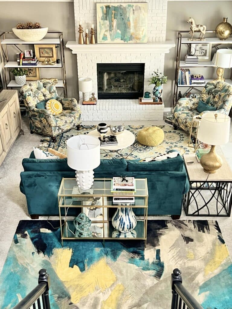 A glamorous living room with turquoise and gold furniture pieces.