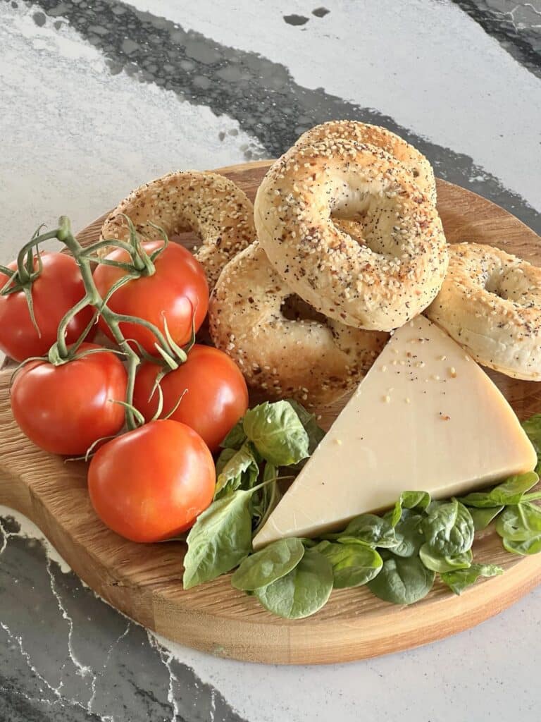 Everything bagels, tomatoes, and parmesan cheese.