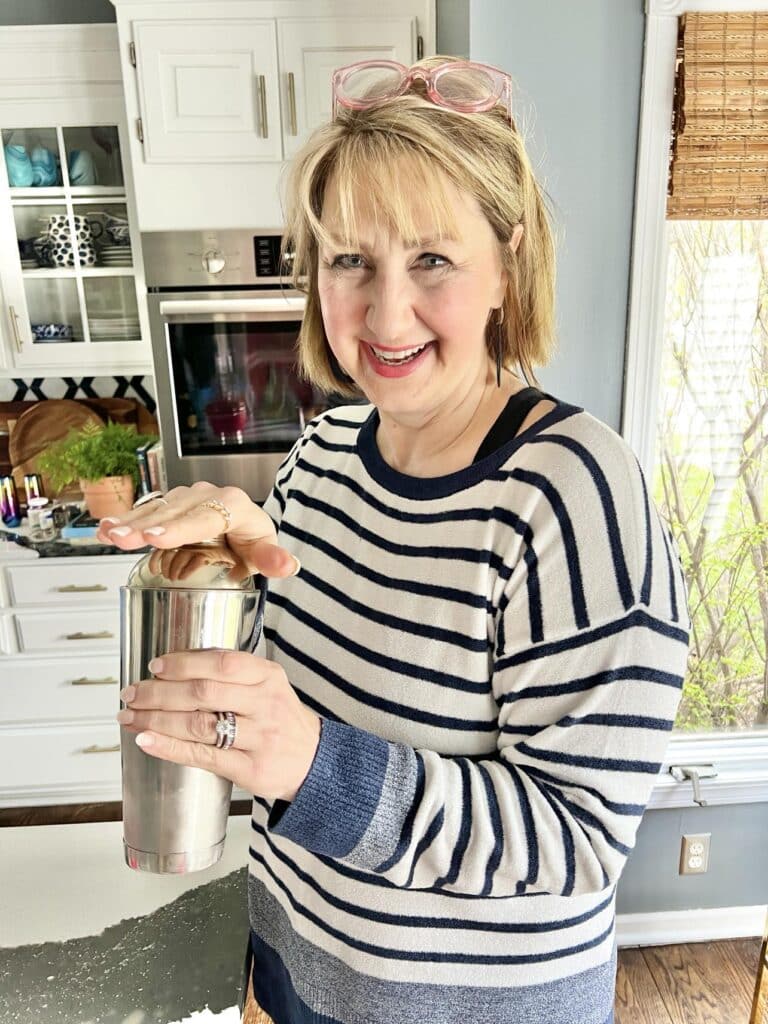 Missy shaking ingredients for a French 75 recipe with vodka for a French 76.