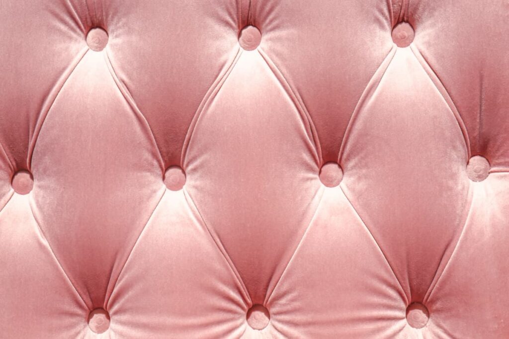 Glamorous decorating ideas such as this pink velvet tufted headboard.