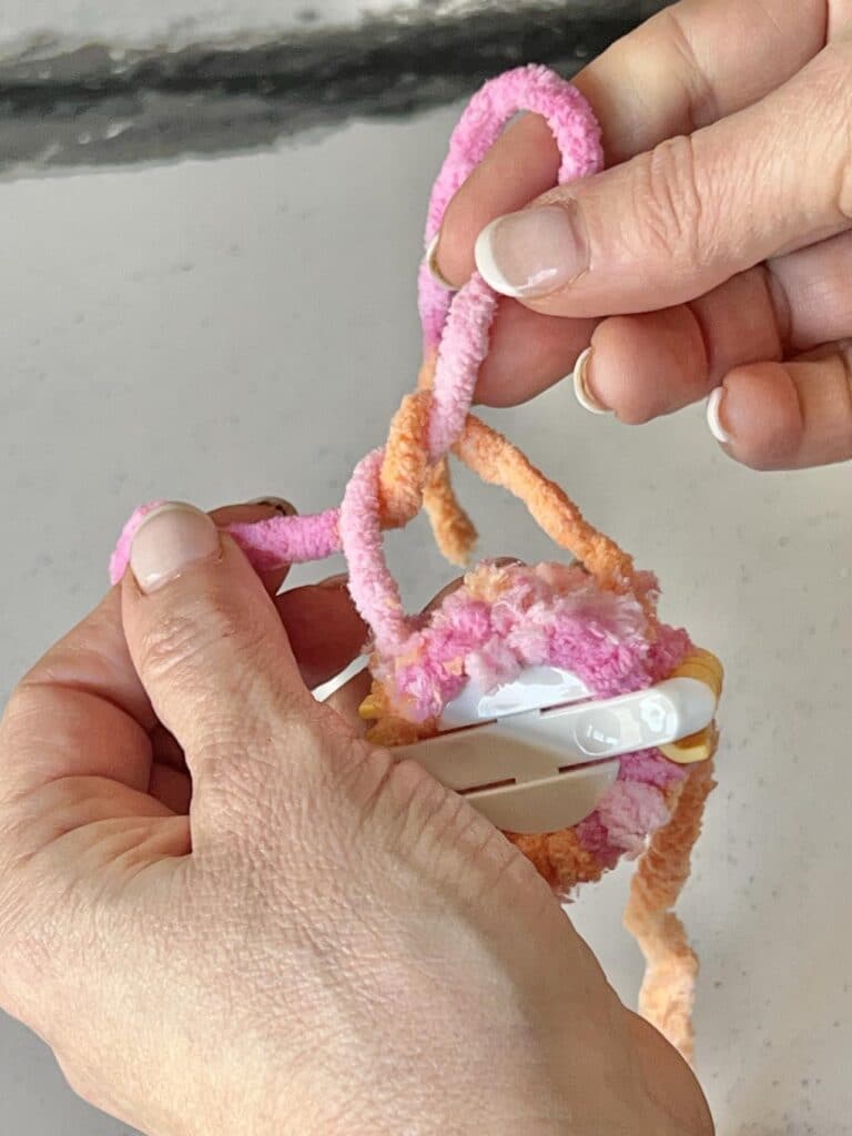 Wrapping a yarn loop.