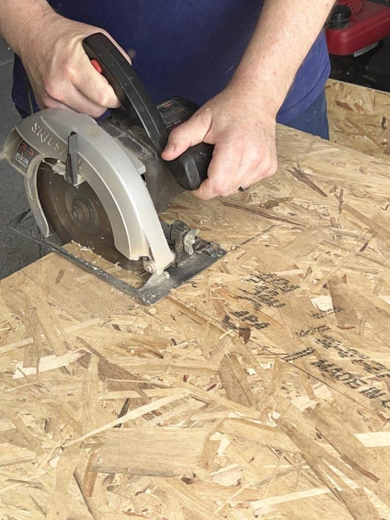 Cutting OSB wood for a coffee table ottoman diy.
