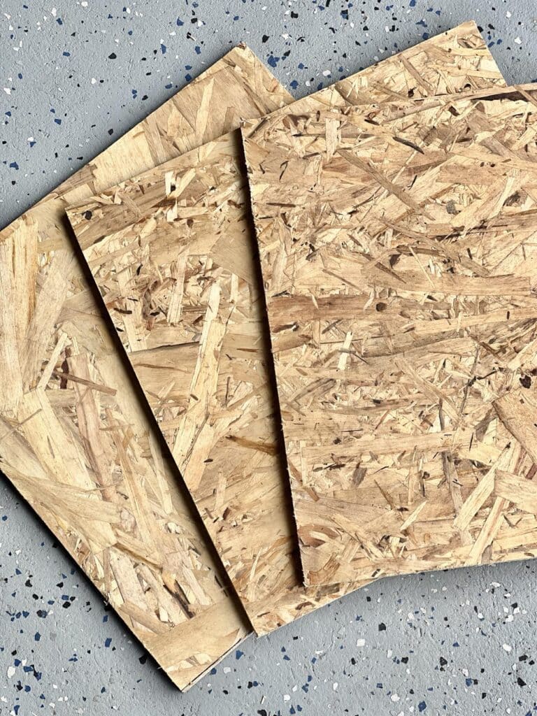 Three square pieces of wood.