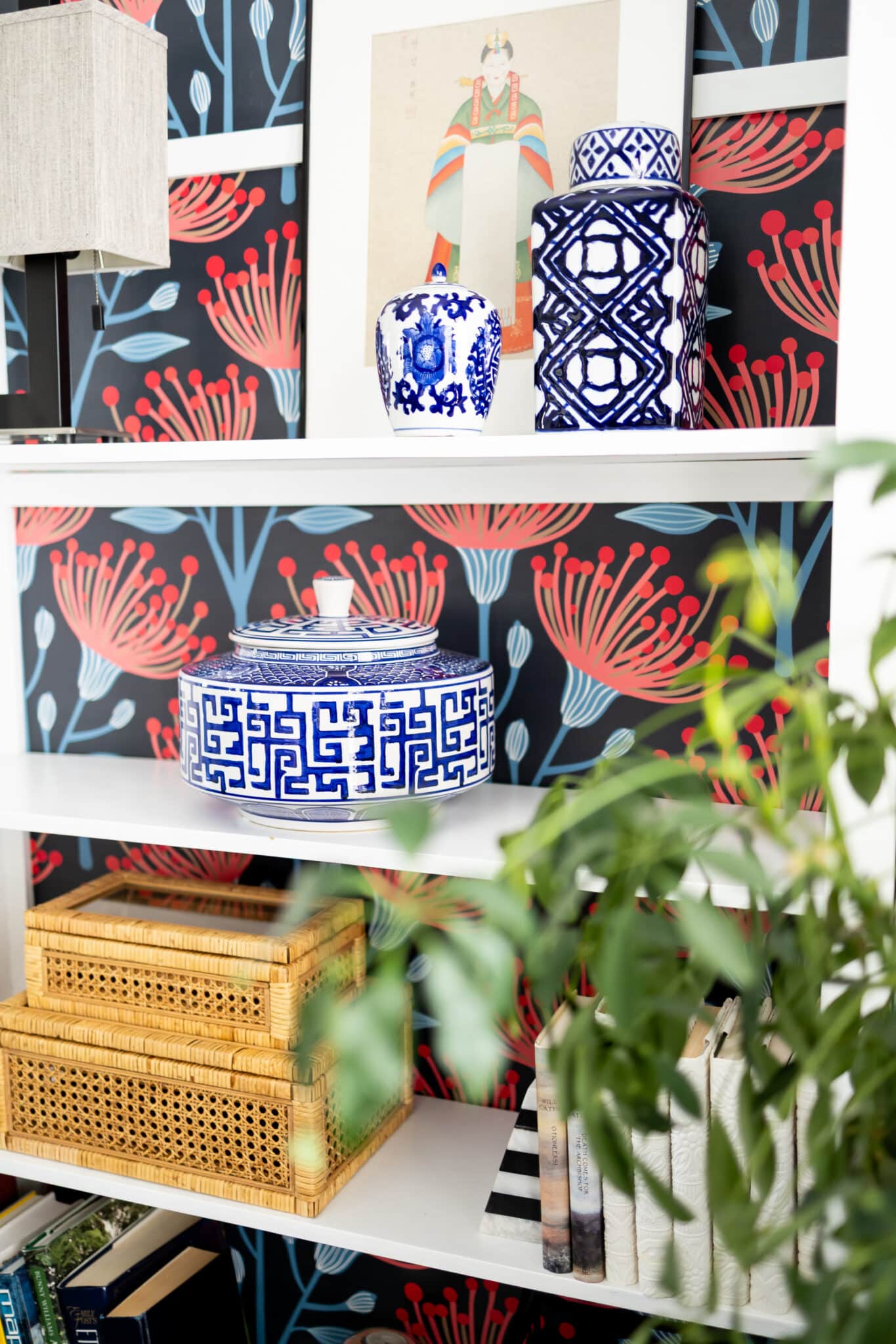 Bookcase filled with chinoiserie decor.