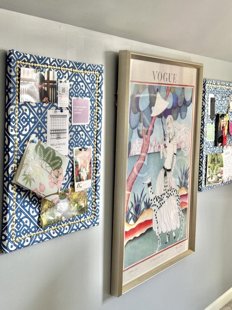 cork board ideas include hanging two upholstered corkboards on either side of artwork hanging on the wall.