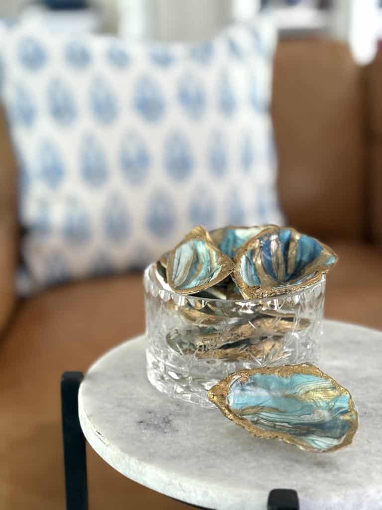 Decoupage oyster shells in a glass bowl.