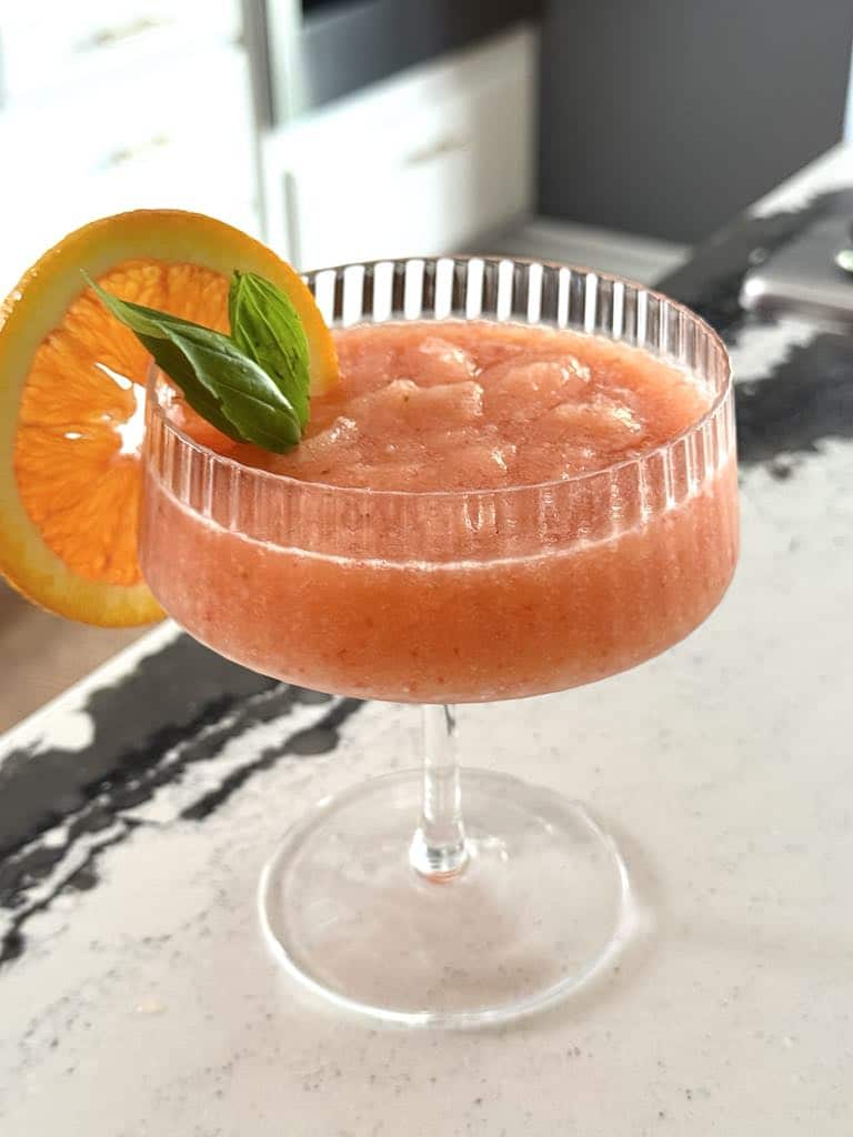 frozen aperol spritz in a coup glass