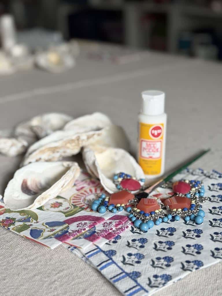 Oysters shells, paper napkins, and Mod Podge decoupage glue.