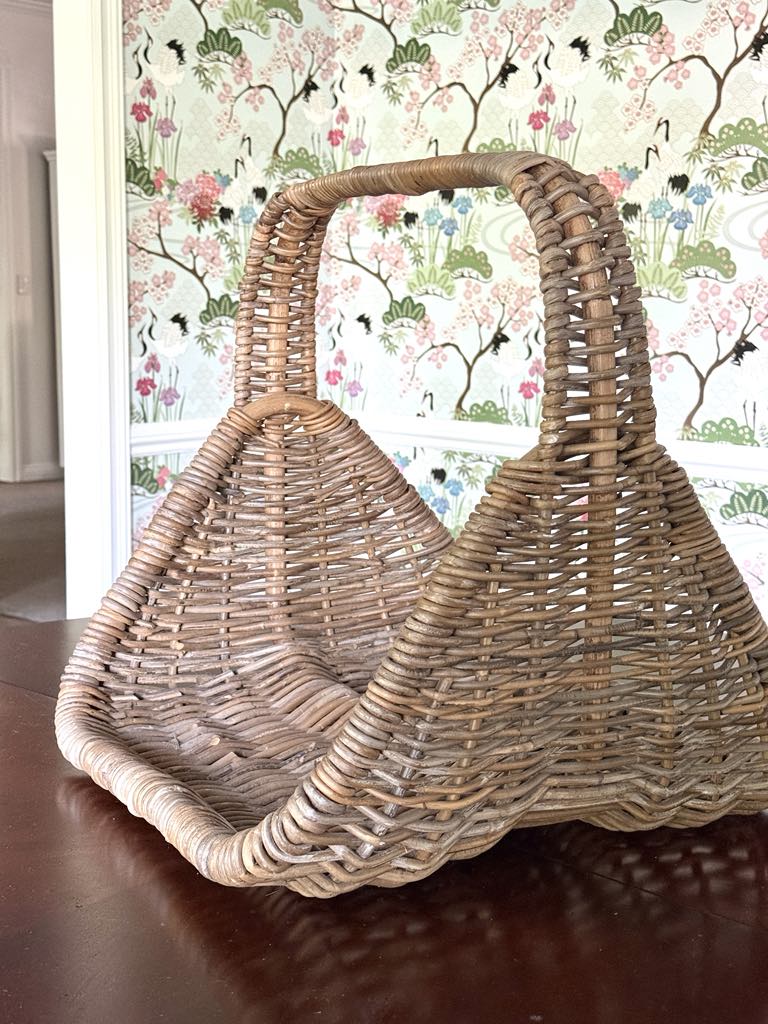 A vintage basket with a handle.