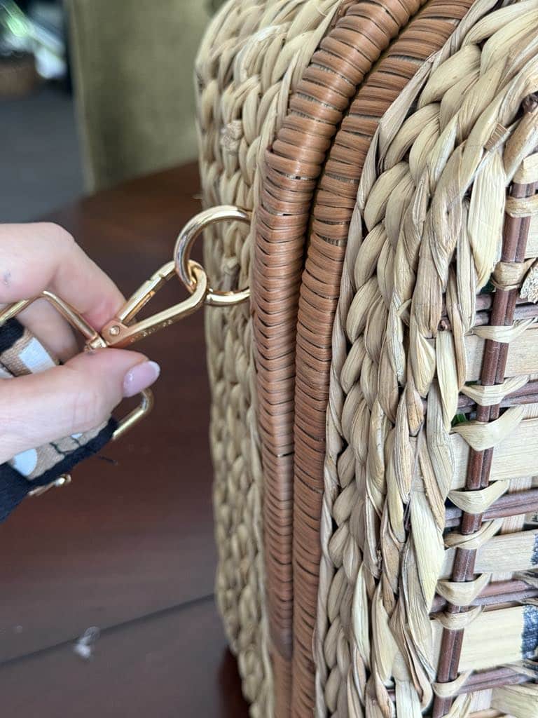 Attaching a purse guitar strap to the side of an upcycled picnic basket.