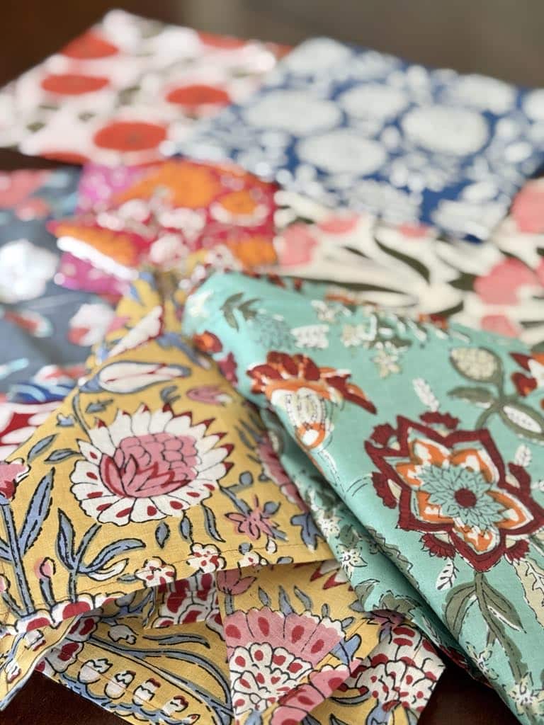 decorating with block prints: a pile of various colorful block print fabric napkins.