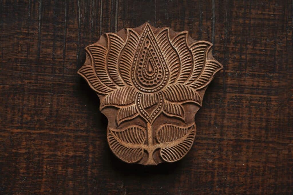 A carved wooden block for fabric printing.