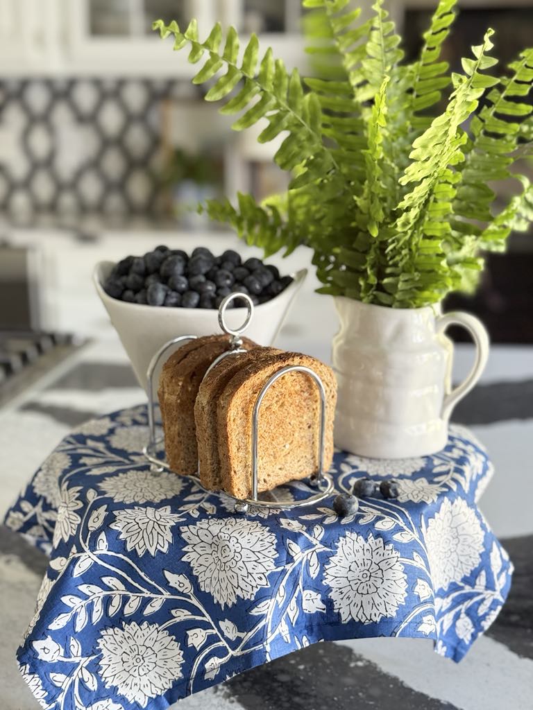 A pedestal with a block print fabric drape.