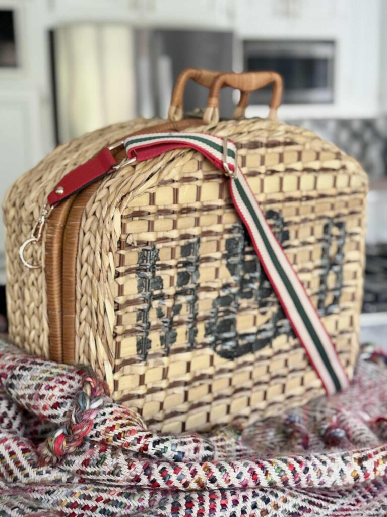 DIY picnic basket on a multi-colored blanket