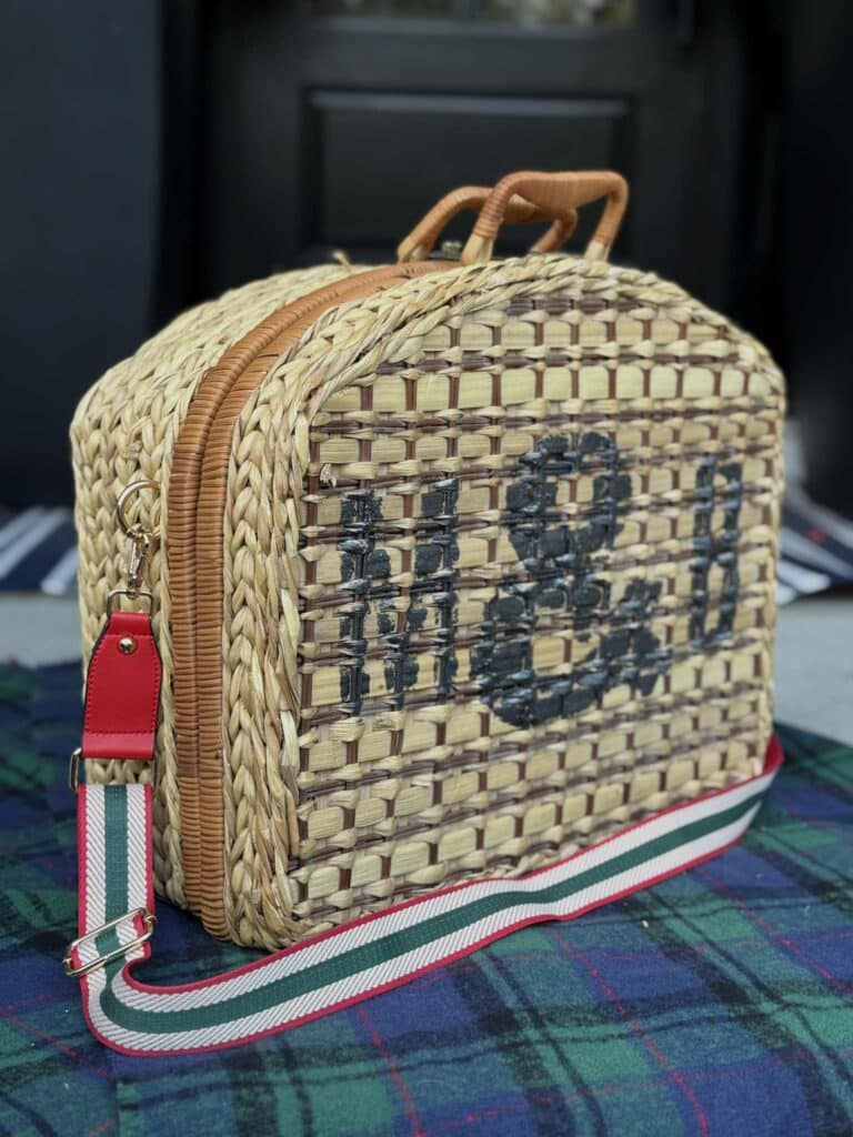 Monogrammed picnic basket with purse guitar strap.