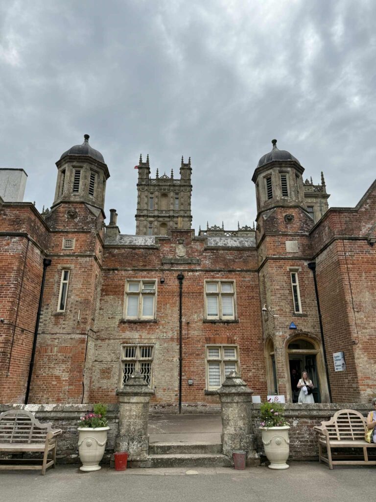 Visitors on the Downton Abbey Tour exiting the back of Highclere Castle.