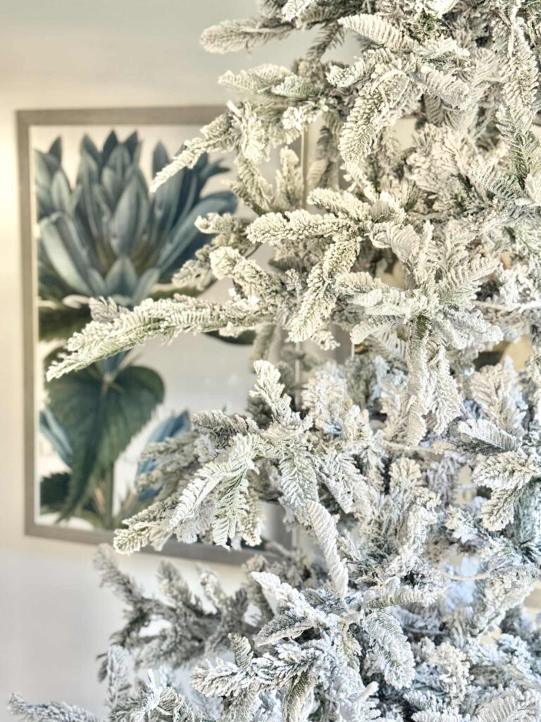 A flocked Christmas tree waiting to be decorated.