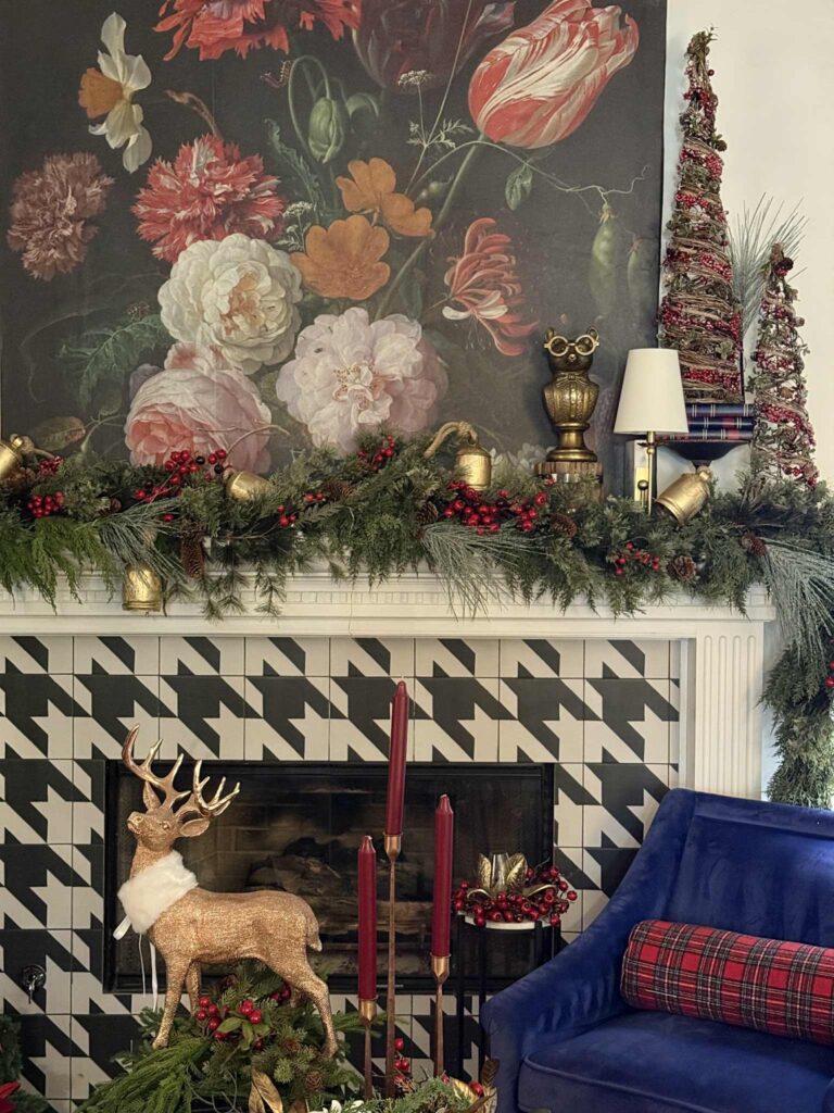 Upcycled canvas wall art on a fireplace mantel decorated for Christmas.