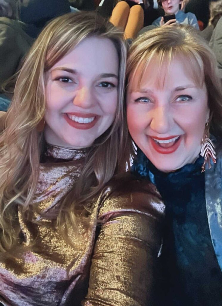 Two women smiling.