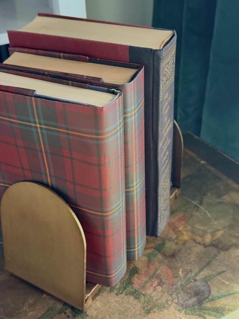 Books covered with red plaid wrapping paper.