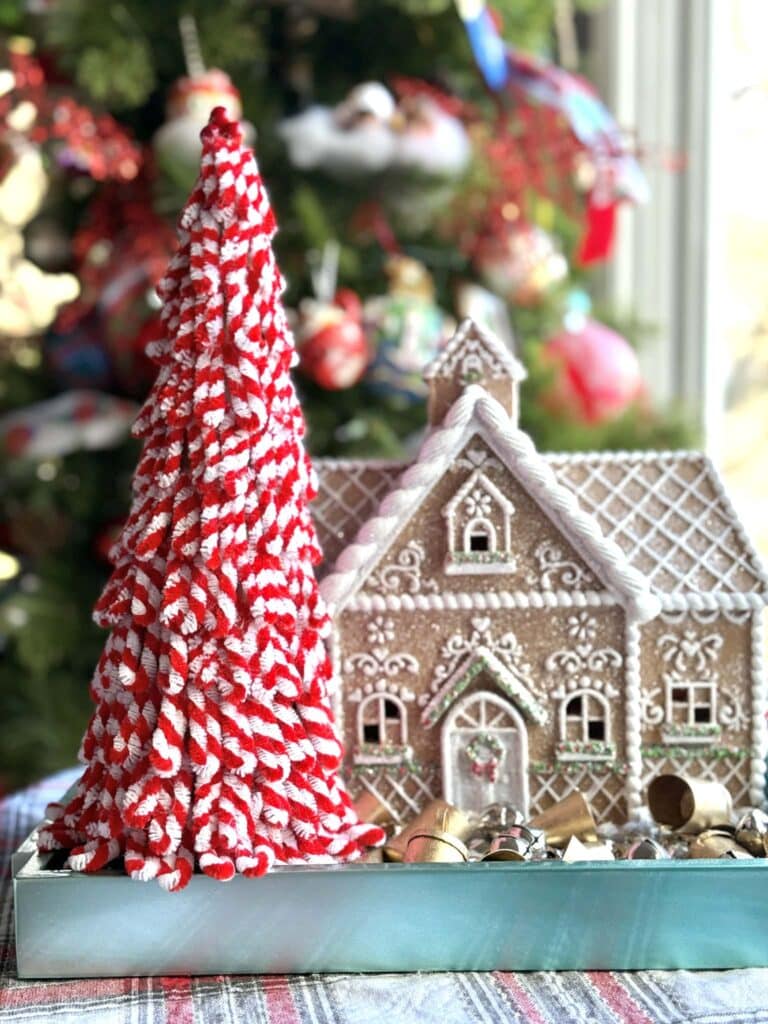 A pipe cleaner tree with candy cane stripe loops.