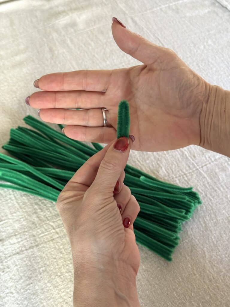 Twisting small pipe cleaner loops for pipe cleaner Christmas tree.