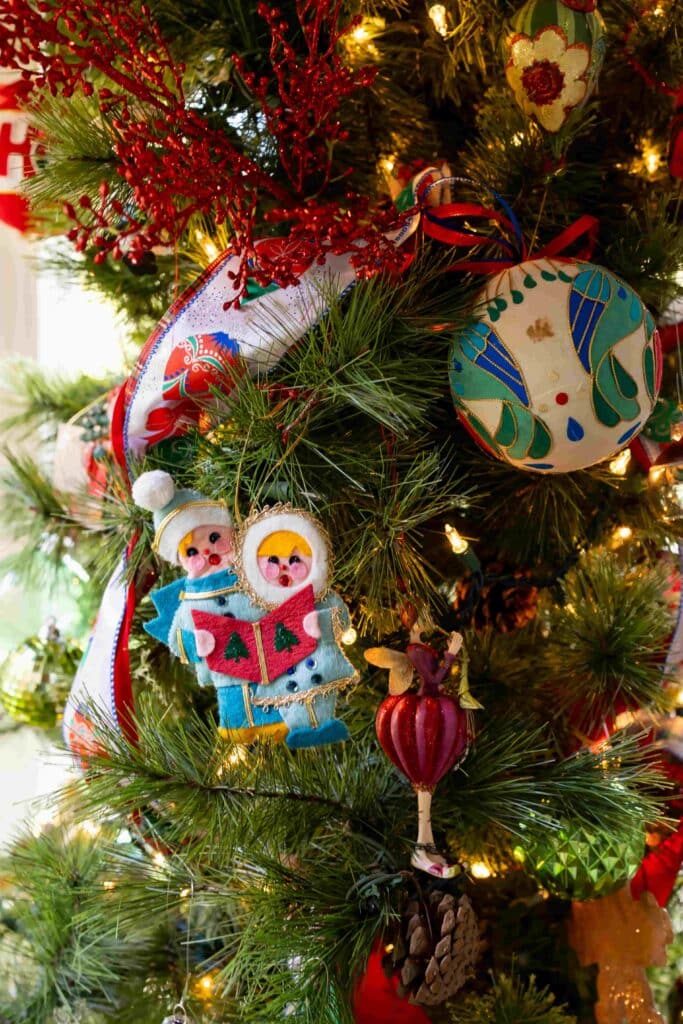 homemade felt Christmas ornaments on a tree.
