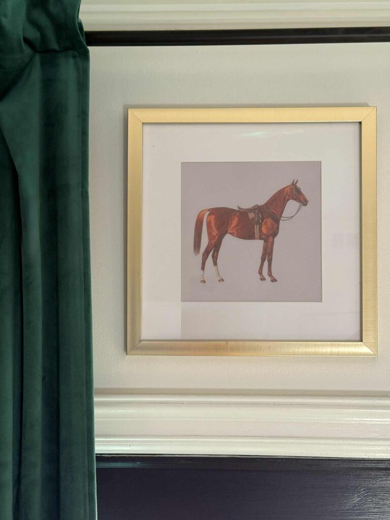 Framed horse print.