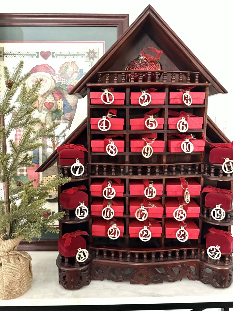 A thrift store display piece filled with Advent calendar gift ideas.