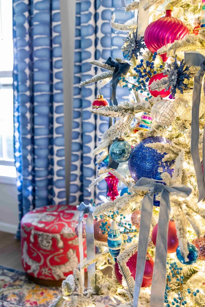 Christmas tree decorating ideas include colorful ornaments and velvet bows.
