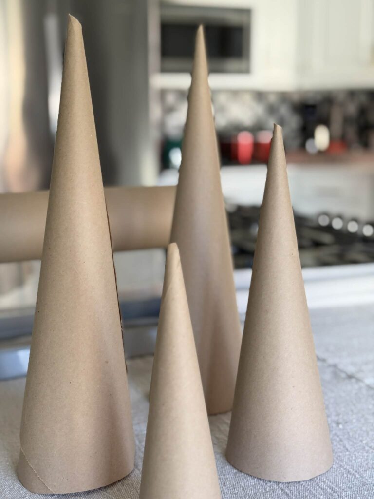 Paper cones of various heights for diy pipe cleaner Christmas trees.