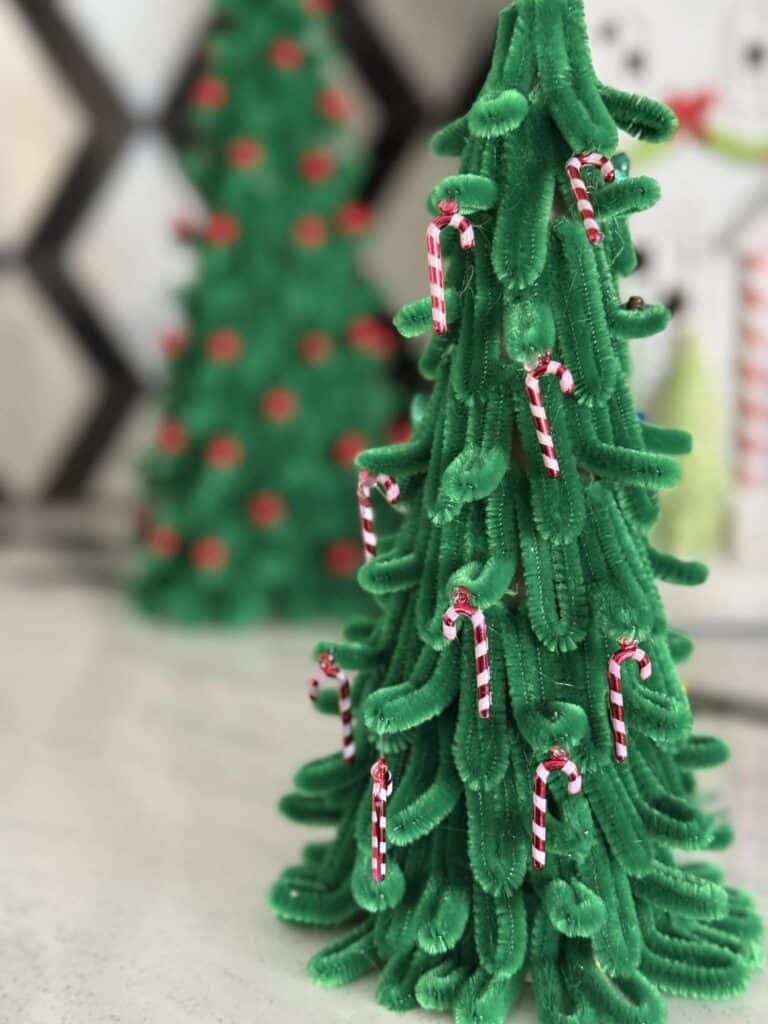 Tiny pipe cleaners on a pipe cleaner Christmas tree.
