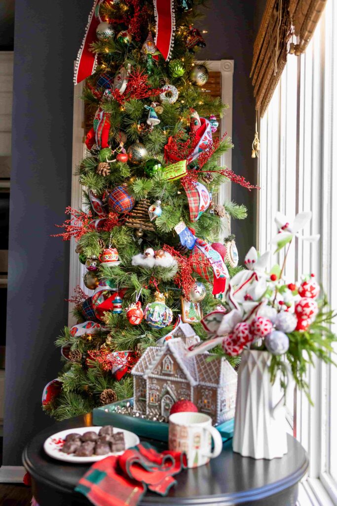 A kitchen Christmas tree decorated with colorful ornaments.