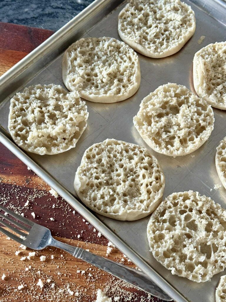 Split English muffins on a tray