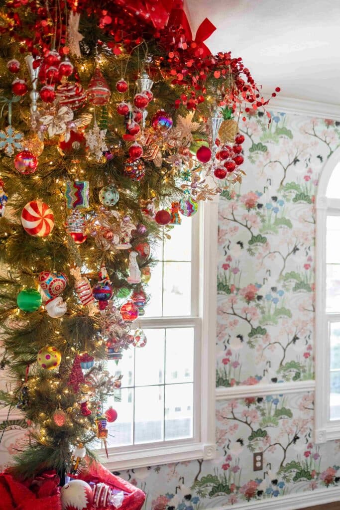 Christmas tree decorating ideas include an upside down Christmas tree in a dining room.
