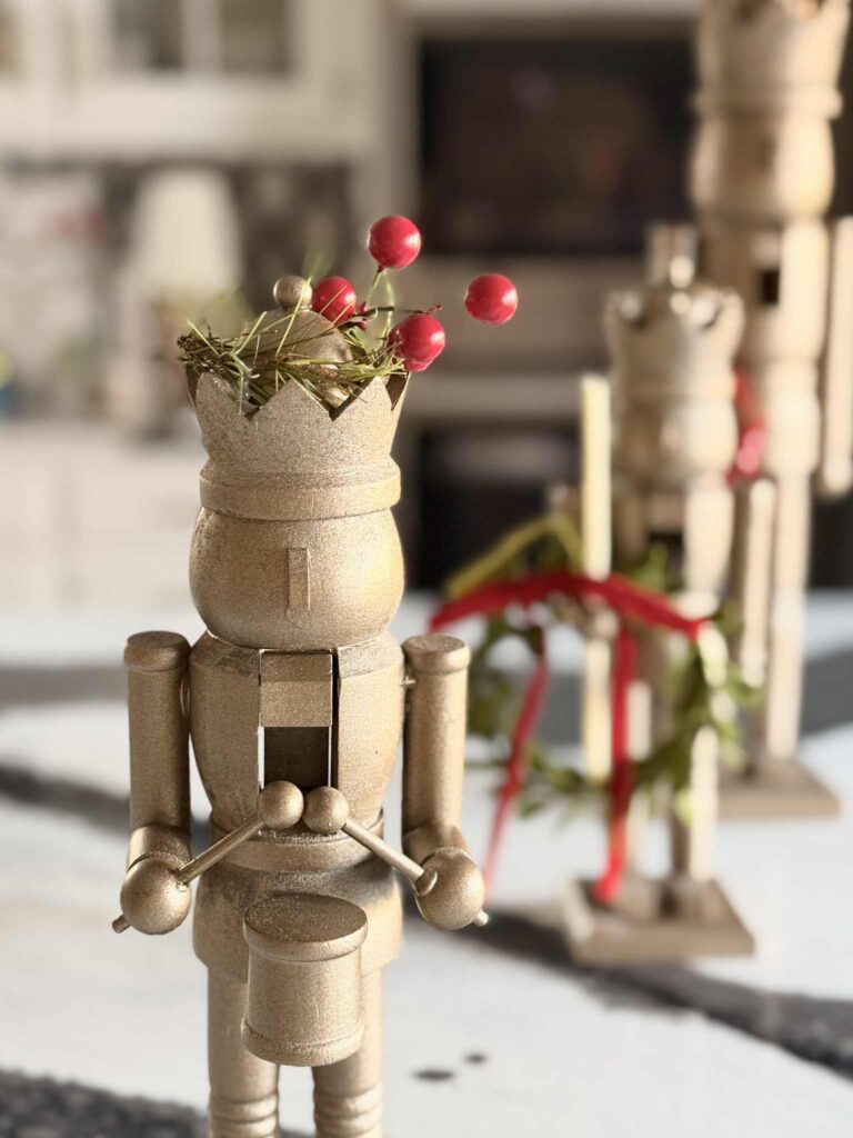 A nutcracker drummer with Christmas berries in the crown.