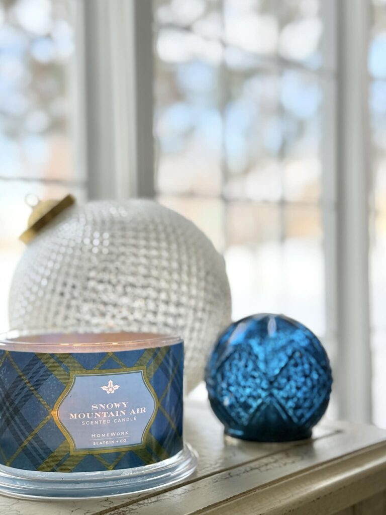 A jar candle with a blue pattern on the glass.