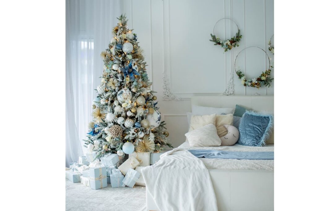 A bedroom decorated for Christmas in blue and white.