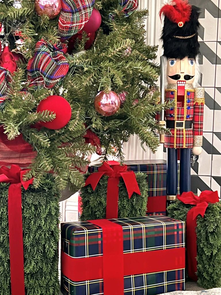 Christmas gift wrapping ideas include these packages wrapped in plaid paper and red velvet ribbon.