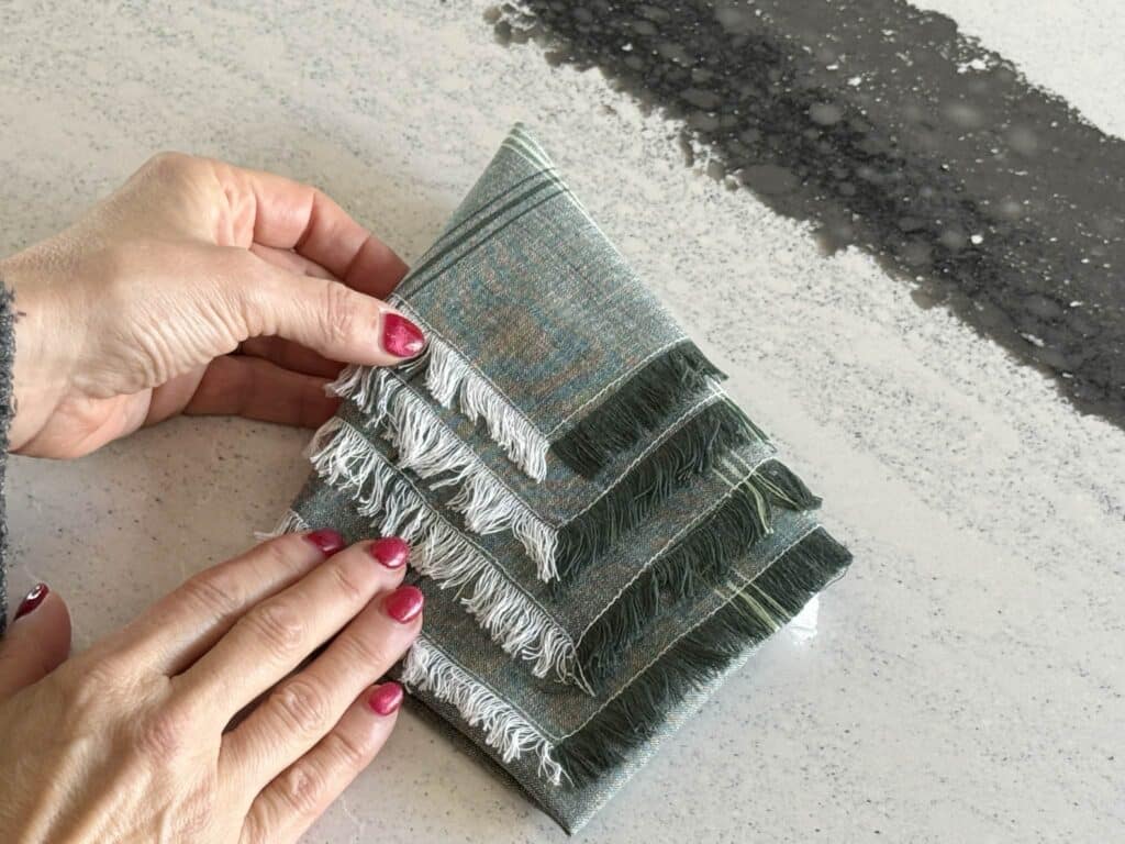 A cloth napkin folded into a triangle shape.