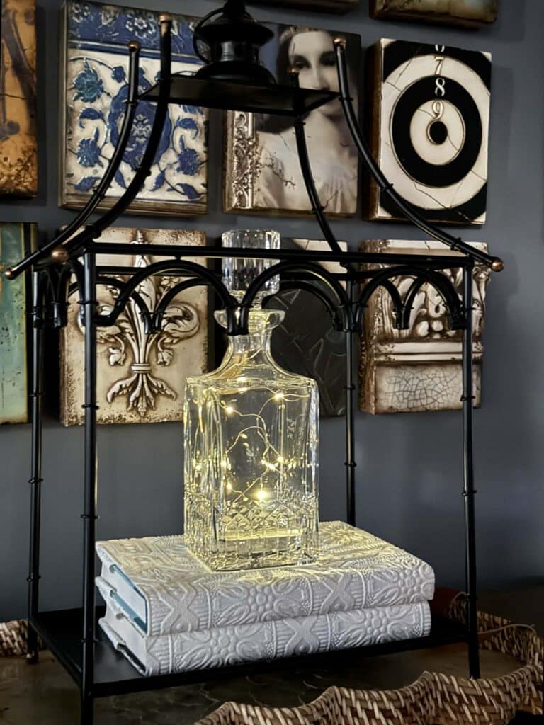 Cork fairy lights in a cut glass decanter.