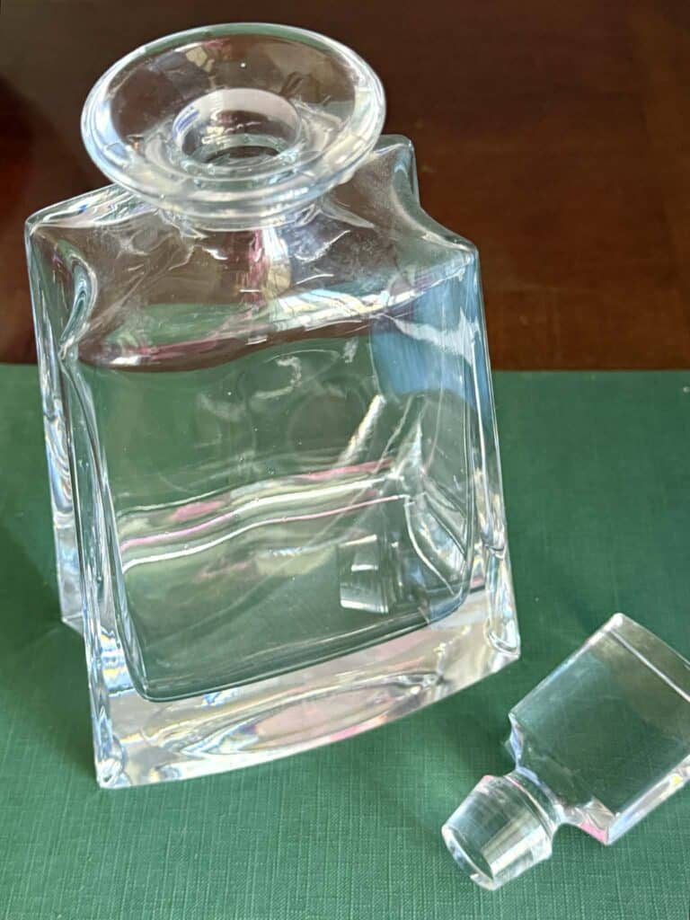 A glass decanter and stopper
