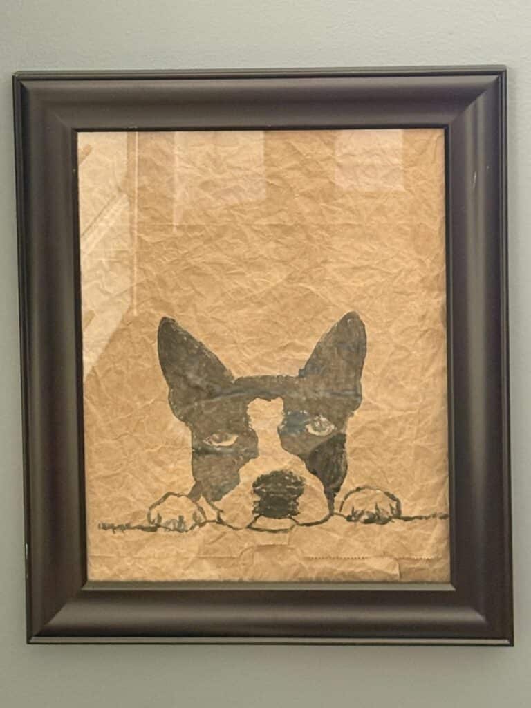 paper bag art with the image of a Boston terrier dog painted on it.