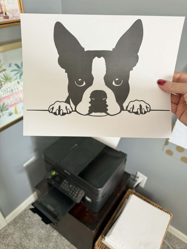 A piece of paper with the image of a Boston Terrier dog printed on it.