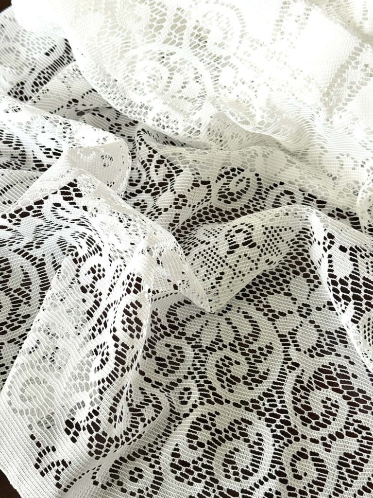 Thrifted lace panel used for decoupage plates.
