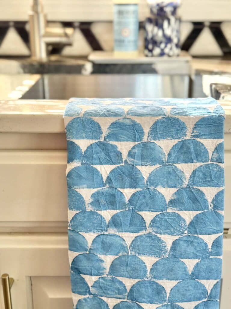 A tea towel block printed with a potato.