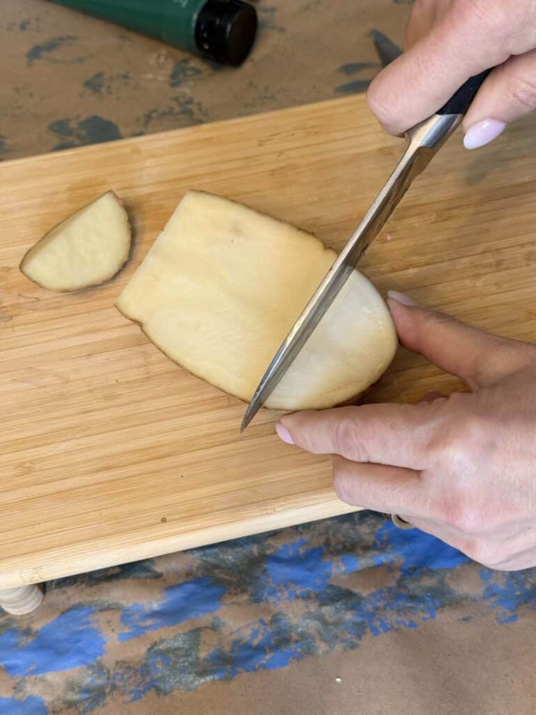 Cutting a potato.
